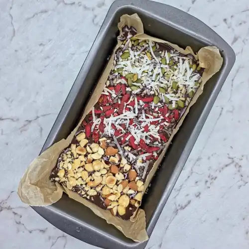  Sprinkle dried fruit, nuts and seeds over melted dark chocolate. 