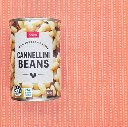 Coles Cannellini Beans. Good source of fibre. 5 Health star rating. No artificial colours & flavours. Packed in Italy from imported ingredients. Available from Coles. 60% cannellini beans. Protein 6.5g per 100g. Sodium 163mg per 100g.