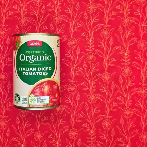 Coles Certified Organic Italian Diced Tomatoes -- 5 Health star rating. Product of Italy. No artificial colours & flavours. 60% tomatoes. Available from Coles. No added salt. Sugars 2.9g per 100g. Sodium 8mg per 100g.