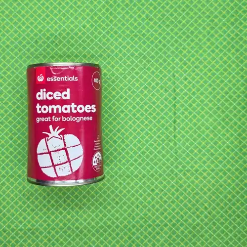 Woolworths Essential Diced Tomatoes. 4.5 health star rating. Made in Italy. Can opener needed. 60% tomatoes. Available from Woolworths. Sugars 3.1g per 100g. Sodium 5mg per 100g.