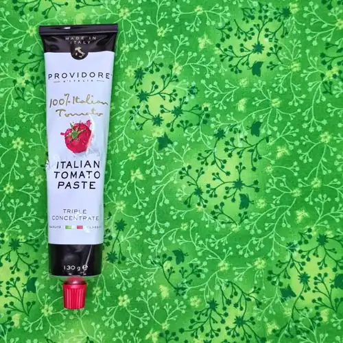 Providore D'Italia Italian Tomato Paste. Triple concentrate. Made in Italy. 100% Italian tomatoes. Qualita Classica. Made in Italy. 4 Health Star Rating. From the region of Emilia-Romagna. Available at Coles. Sugars 11.0g per 100g. Sodium 400mg per 100g.