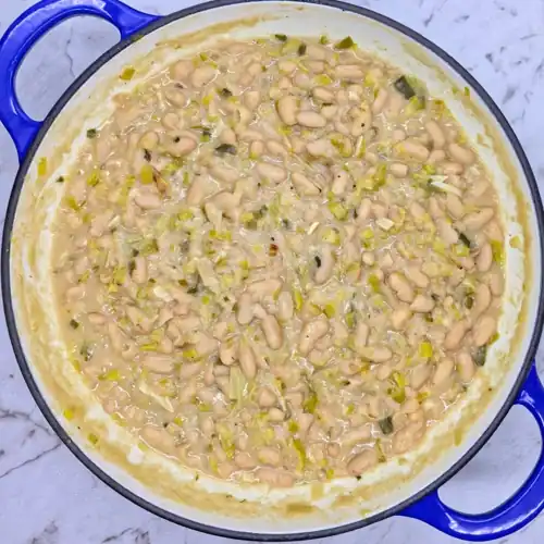 Perfectly cooked Leeky Beans. Simmered gently until thickened and the beans are soft, but not mushy.